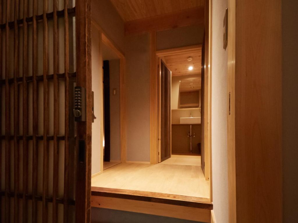Postel nebo postele na pokoji v ubytování sakainoma hotel 熊