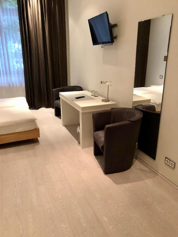 Postel nebo postele na pokoji v ubytování Hotel am Bahnhof