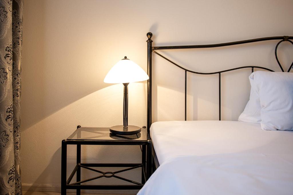 Postel nebo postele na pokoji v ubytování Residence Hattrick