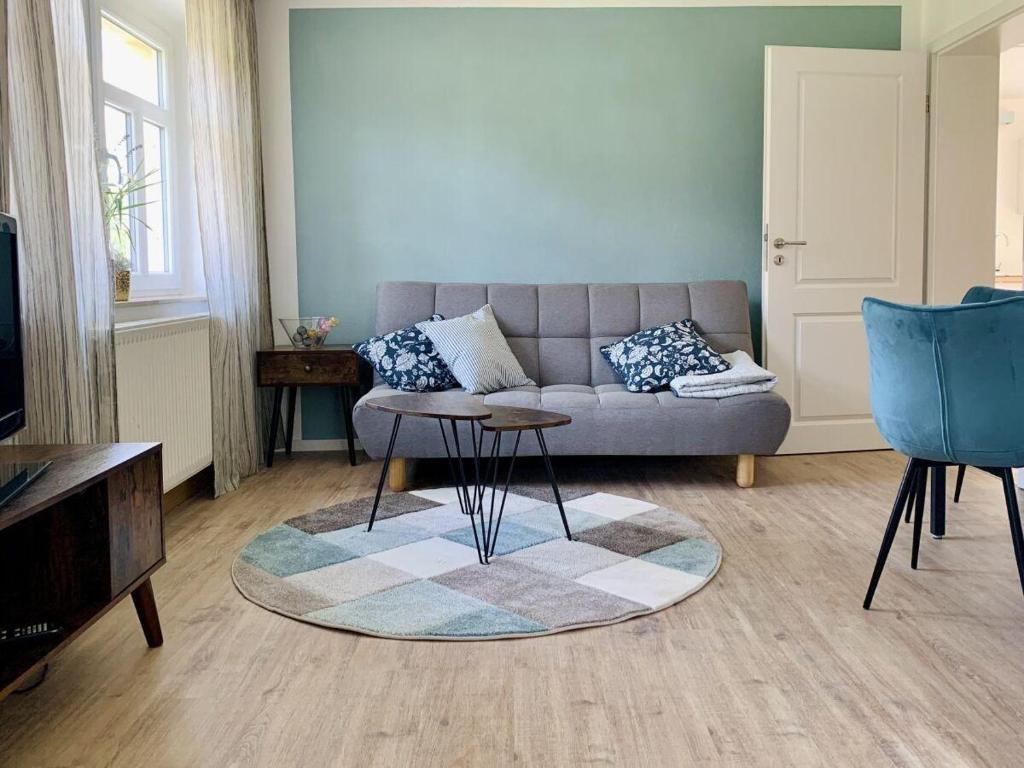 a living room with a couch and a table at Borlaser-Landhaus in Borlas