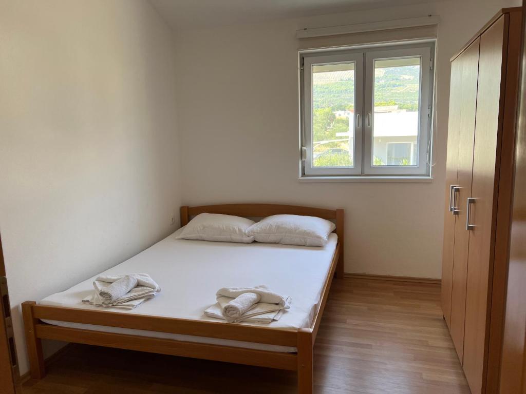 Posteľ alebo postele v izbe v ubytovaní Seaview Apartments Lagetar