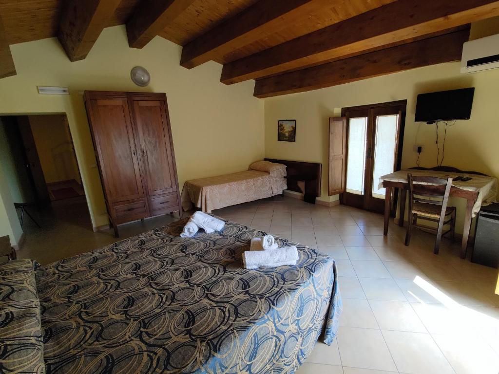 Postel nebo postele na pokoji v ubytování Albergo Diffuso IL MIGLIO