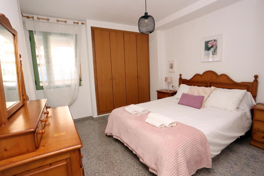 Posteľ alebo postele v izbe v ubytovaní Apartamento dos habitaciones primera línea de playa