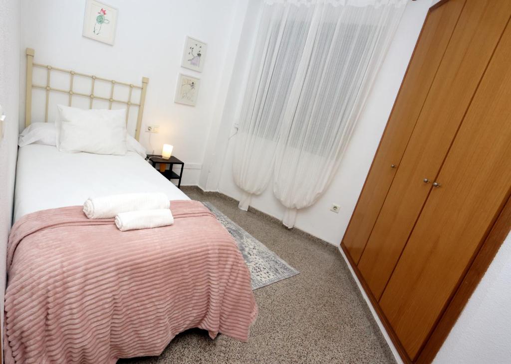 Posteľ alebo postele v izbe v ubytovaní Apartamento dos habitaciones primera línea de playa