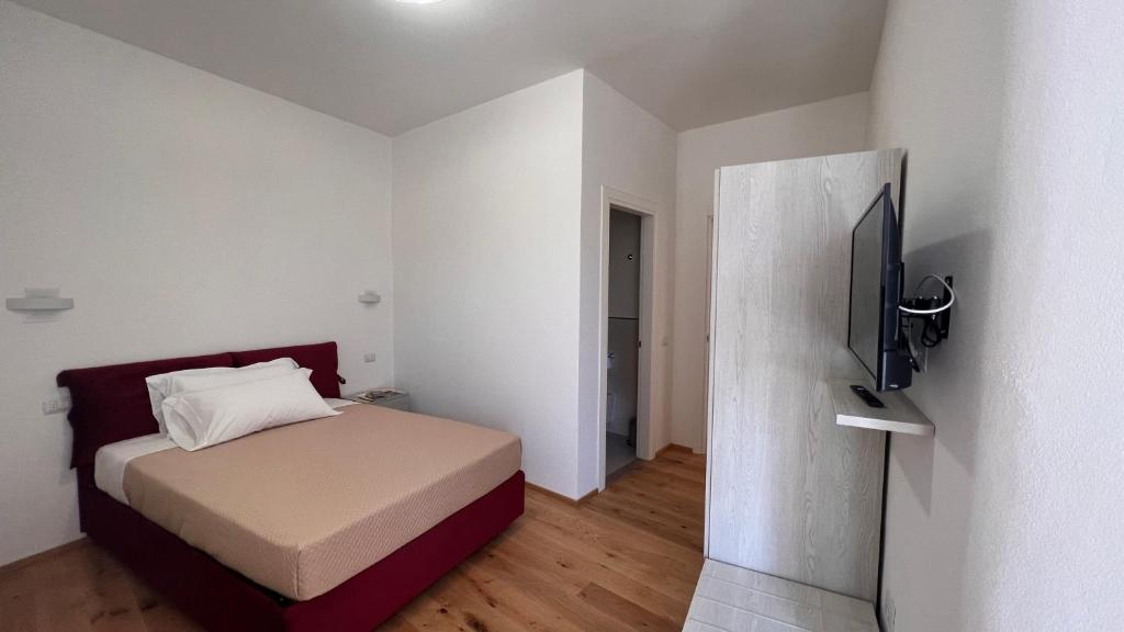 Postel nebo postele na pokoji v ubytování B&B Aurora