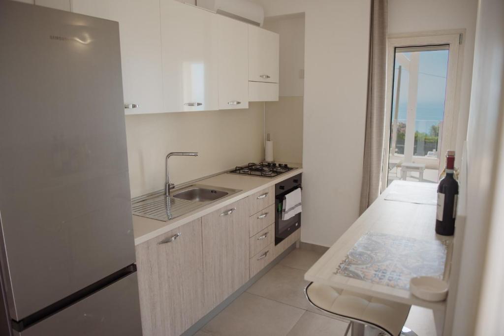 A cozinha ou cozinha compacta de Villa Quantum