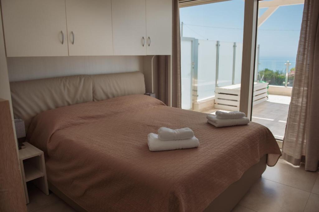 Cama ou camas em um quarto em Villa Quantum
