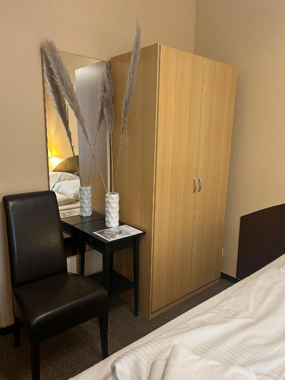 Postel nebo postele na pokoji v ubytování Hotel Adam