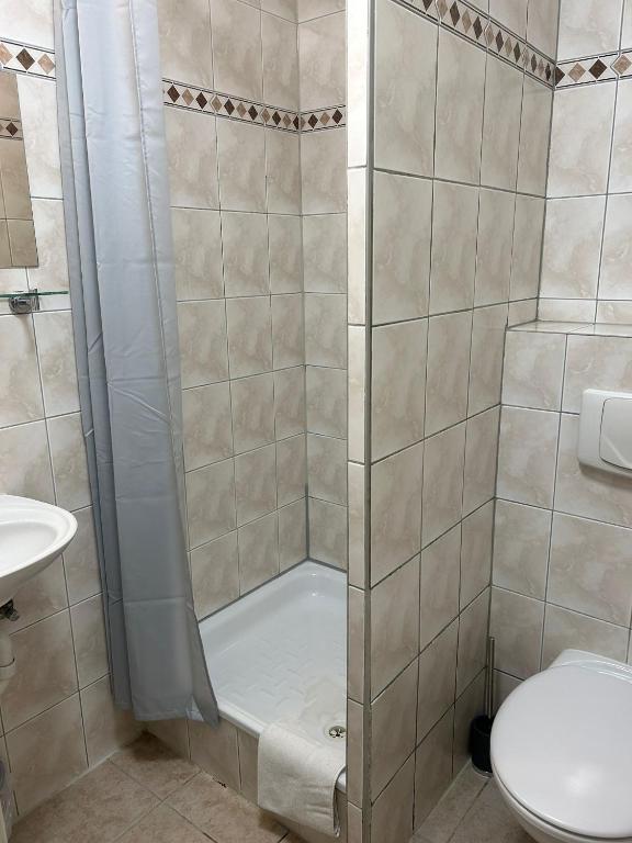 Koupelna v ubytování Hotel Adam