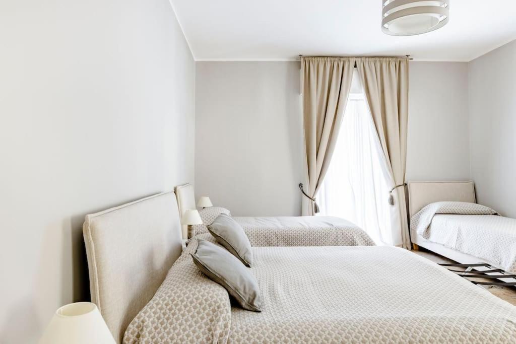 Postel nebo postele na pokoji v ubytování BB SUITE Siracusa