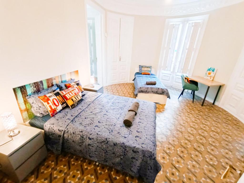Postel nebo postele na pokoji v ubytování By Plaza Catalunya Rooms
