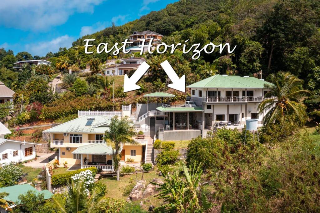 an image of a house on a hill with the words last horizon at East Horizon Self Catering in Au Cap