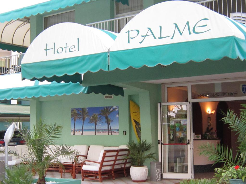 a hotel palaemia sign in front of a store at Hotel Palme in Lido di Jesolo