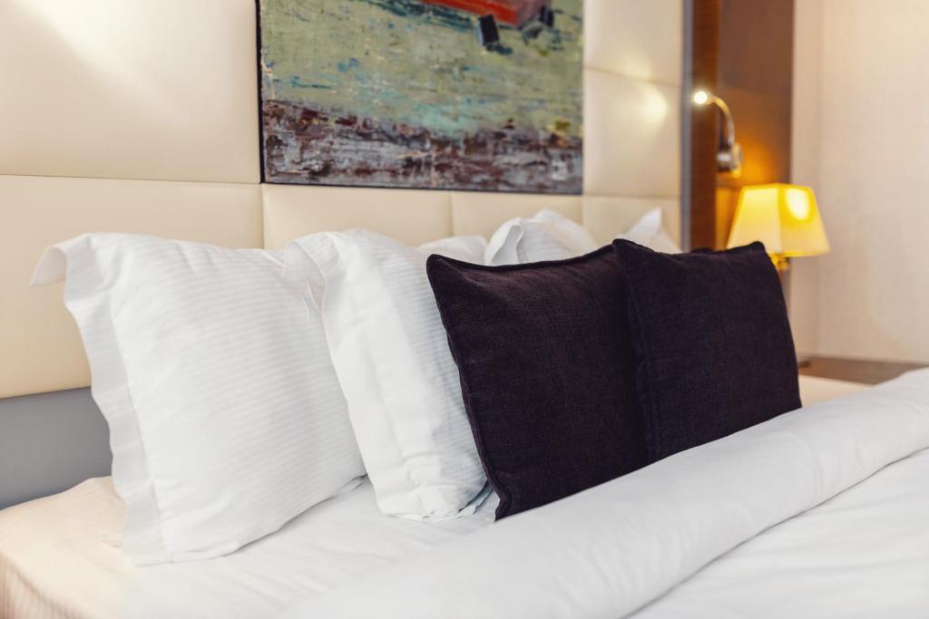 Postel nebo postele na pokoji v ubytování Costé Hotel