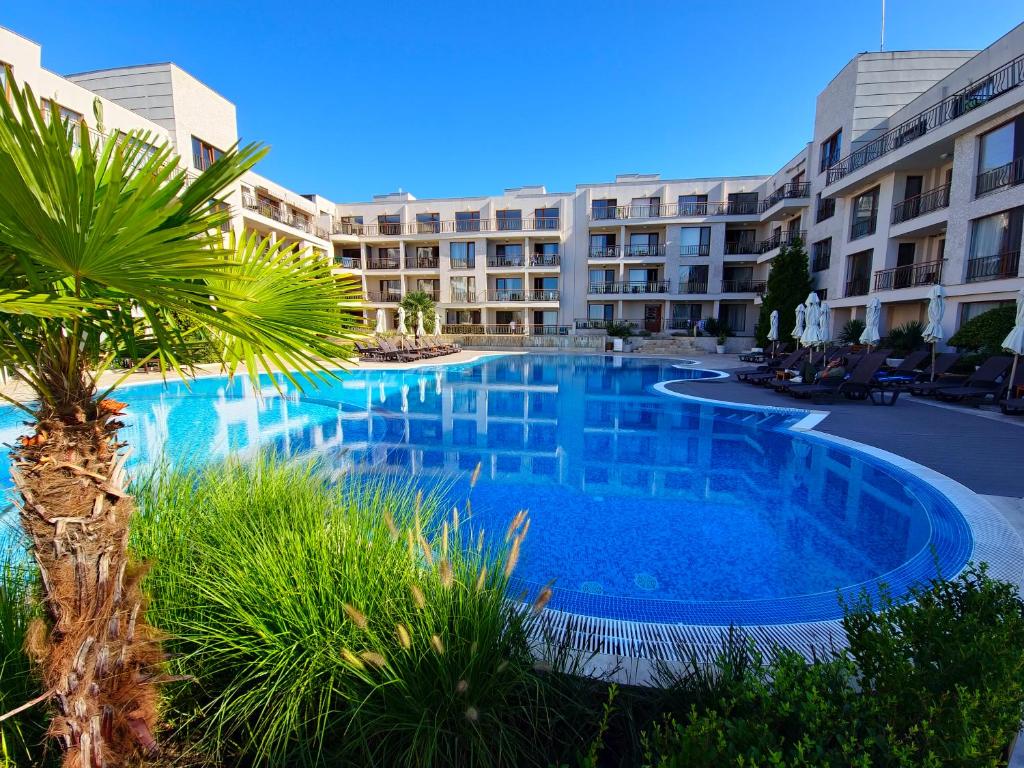 a large swimming pool in front of a building at Diamond Beach Sarafovo by KP in Burgas City