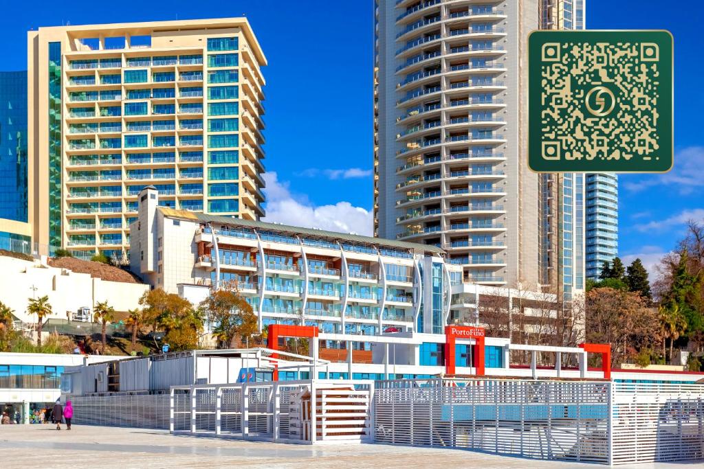 a street sign in front of some tall buildings at Wellness СПА-Отель Грейс Горизонт in Sochi