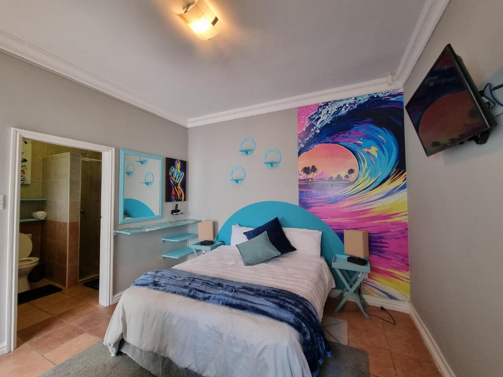 En eller flere senge i et værelse på 7 on Cecilia - Private Studio Apartment with Solar Power