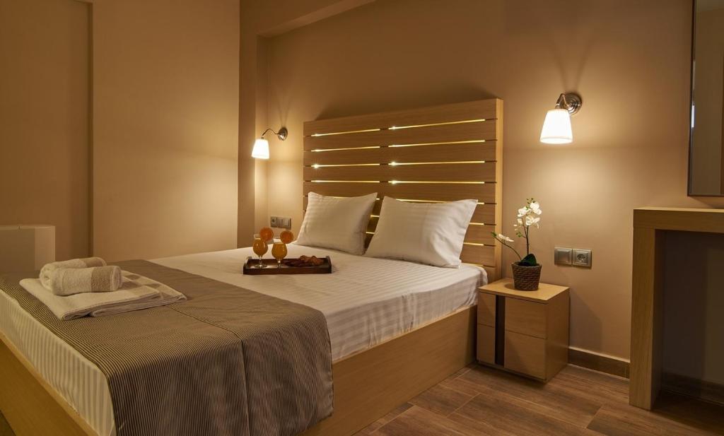 Posteľ alebo postele v izbe v ubytovaní Athos Thea Luxury Rooms