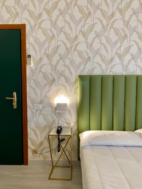 Postel nebo postele na pokoji v ubytování Hotel Liu