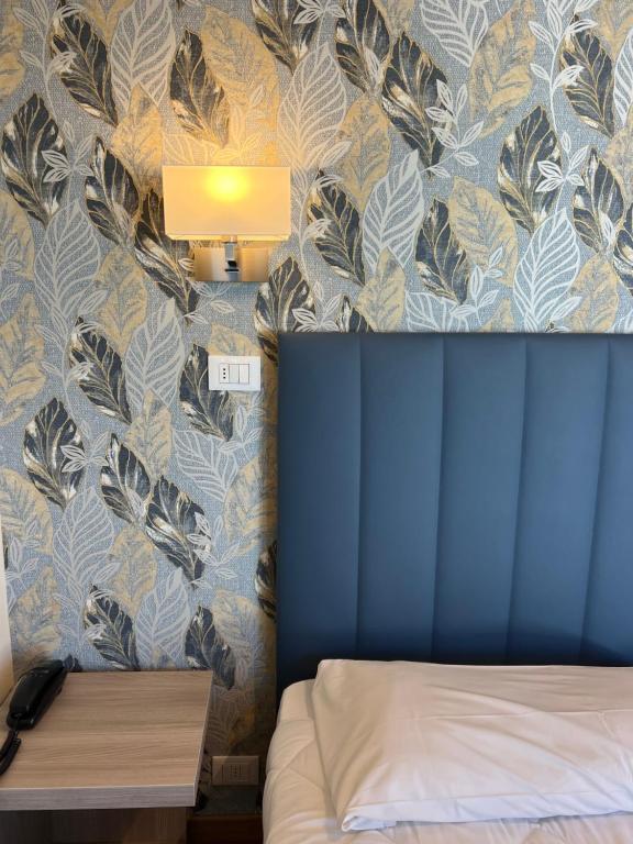 Postel nebo postele na pokoji v ubytování Hotel Liu