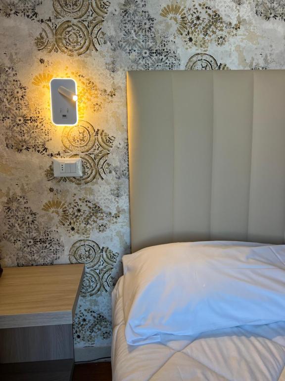 Postel nebo postele na pokoji v ubytování Hotel Liu