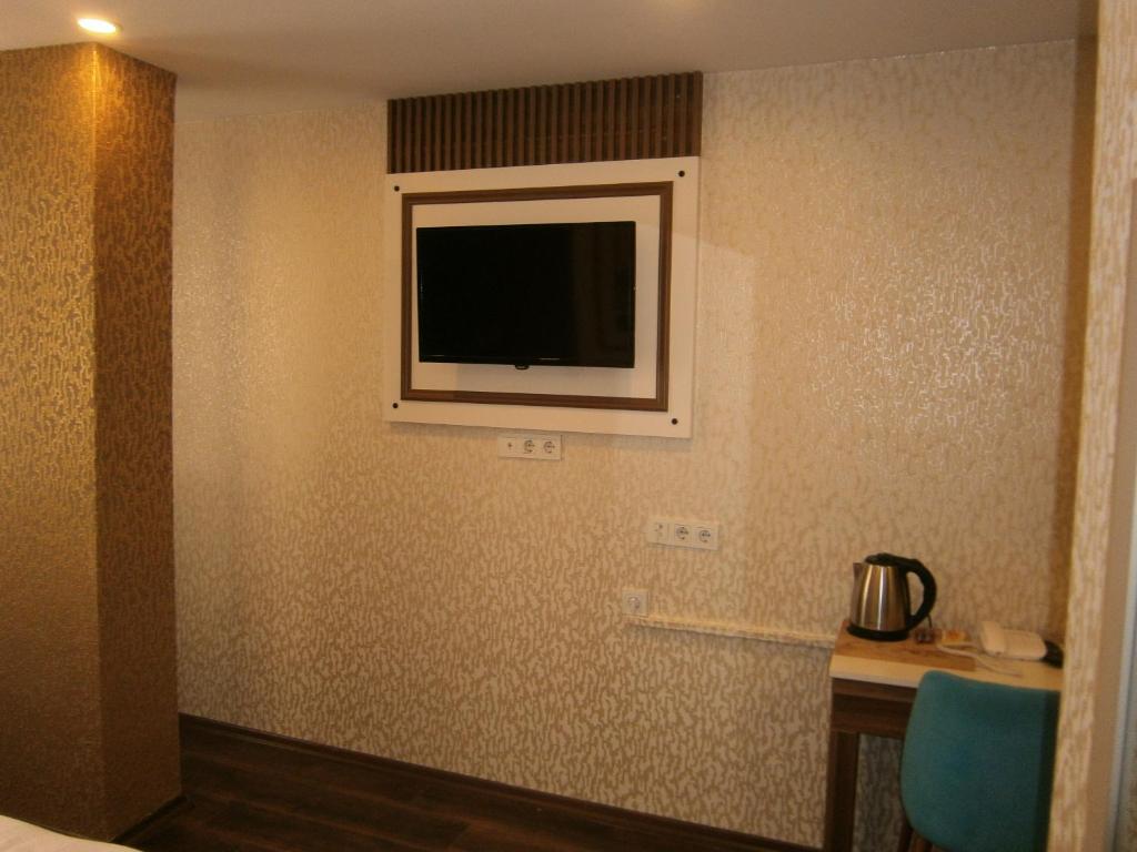 A bed or beds in a room at Nos Istanbul