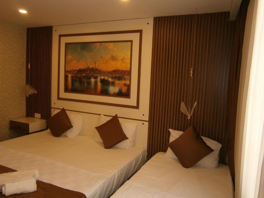 A bed or beds in a room at Nos Istanbul