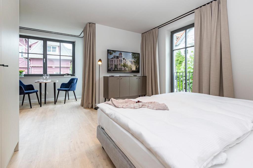 Postel nebo postele na pokoji v ubytování Gustav Appartements