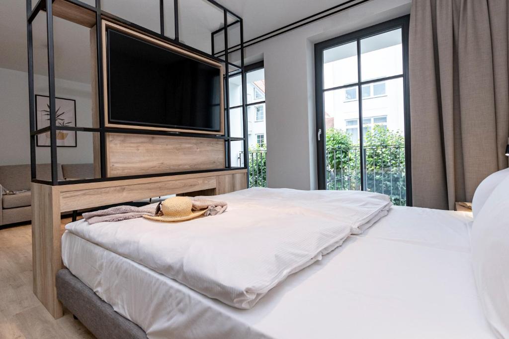 Postel nebo postele na pokoji v ubytování Gustav Appartements