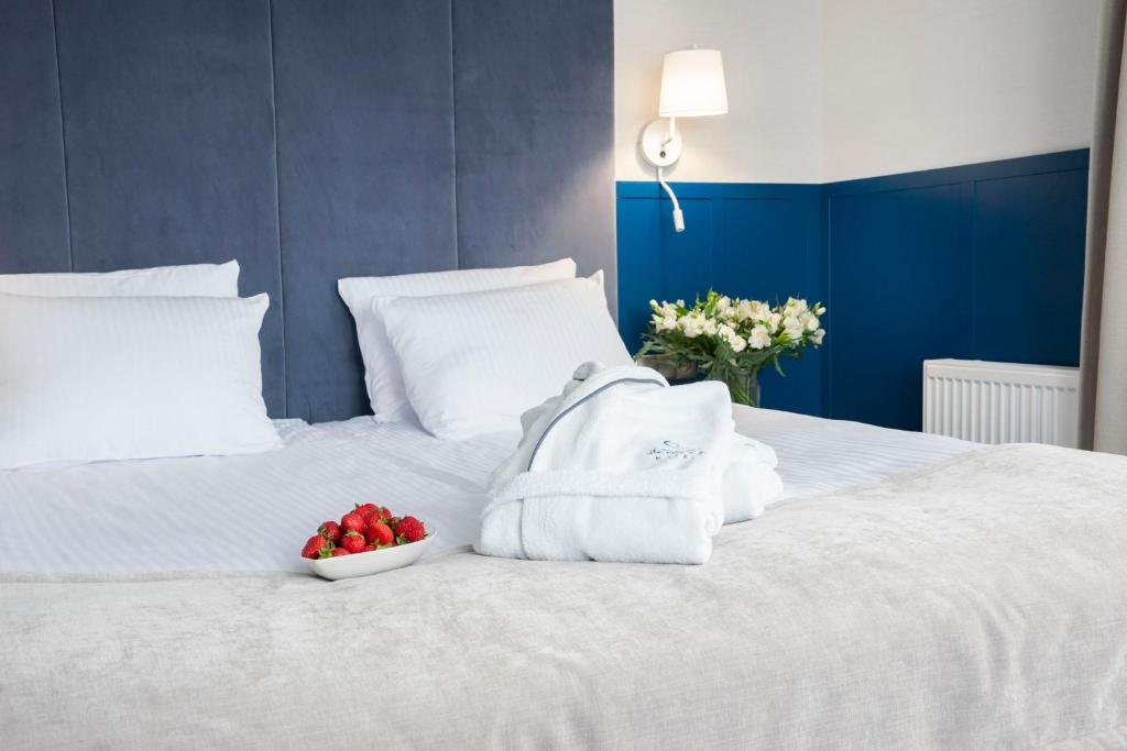 Postel nebo postele na pokoji v ubytování Hotel Szafir
