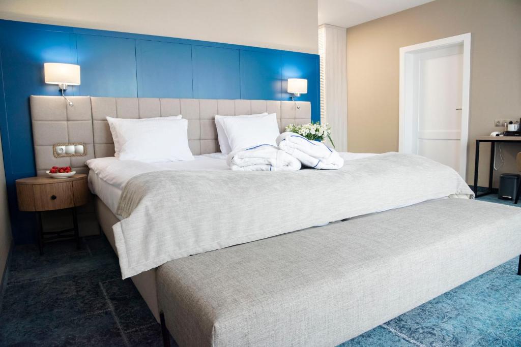 Postel nebo postele na pokoji v ubytování Hotel Szafir
