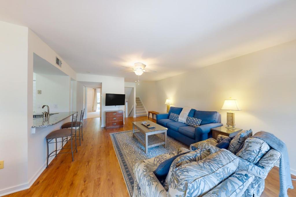 a living room with a couch and a table at Turnberry Village 291 in Hilton Head Island