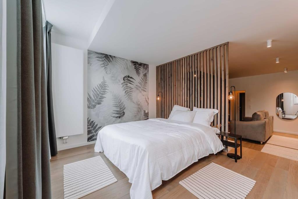 Ліжко або ліжка в номері Chimay : La Chambre Bleue de la Grand Place