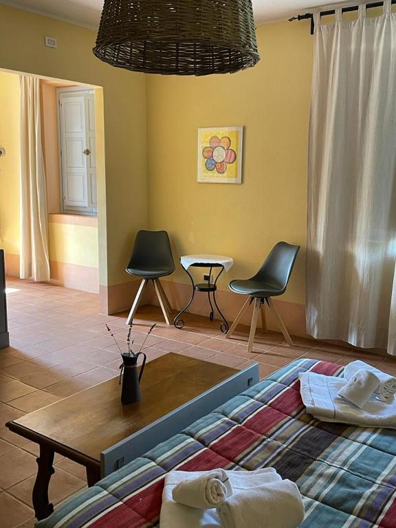 Łóżko lub łóżka w pokoju w obiekcie Agriturismo In Campagna