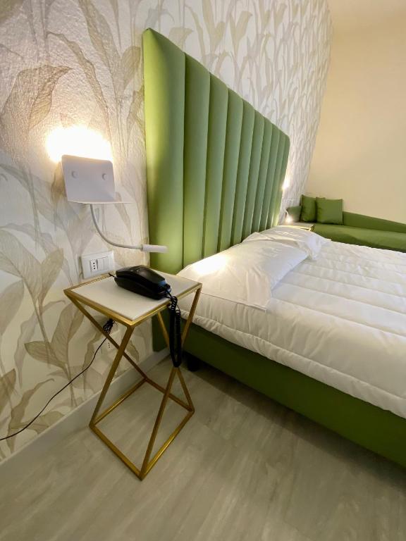 Postel nebo postele na pokoji v ubytování Hotel Liu