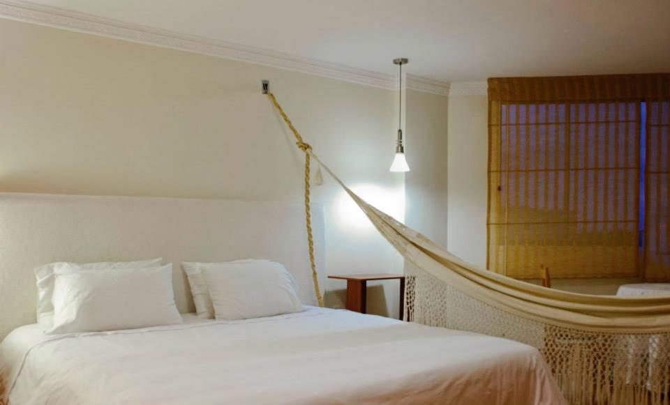 Postel nebo postele na pokoji v ubytování Hotel Sicarare