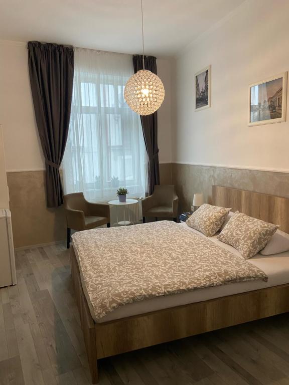 Postel nebo postele na pokoji v ubytování Penzión Bihari