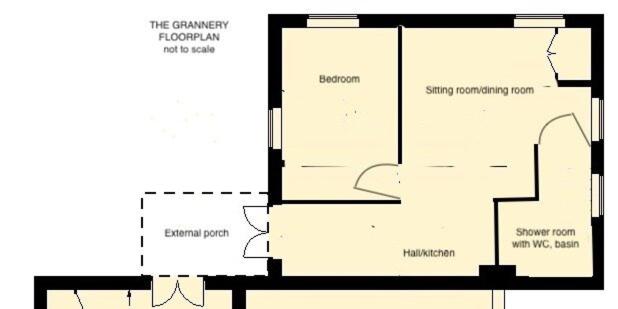a floor plan of a building with diagrams at The Grannery in Wadhurst