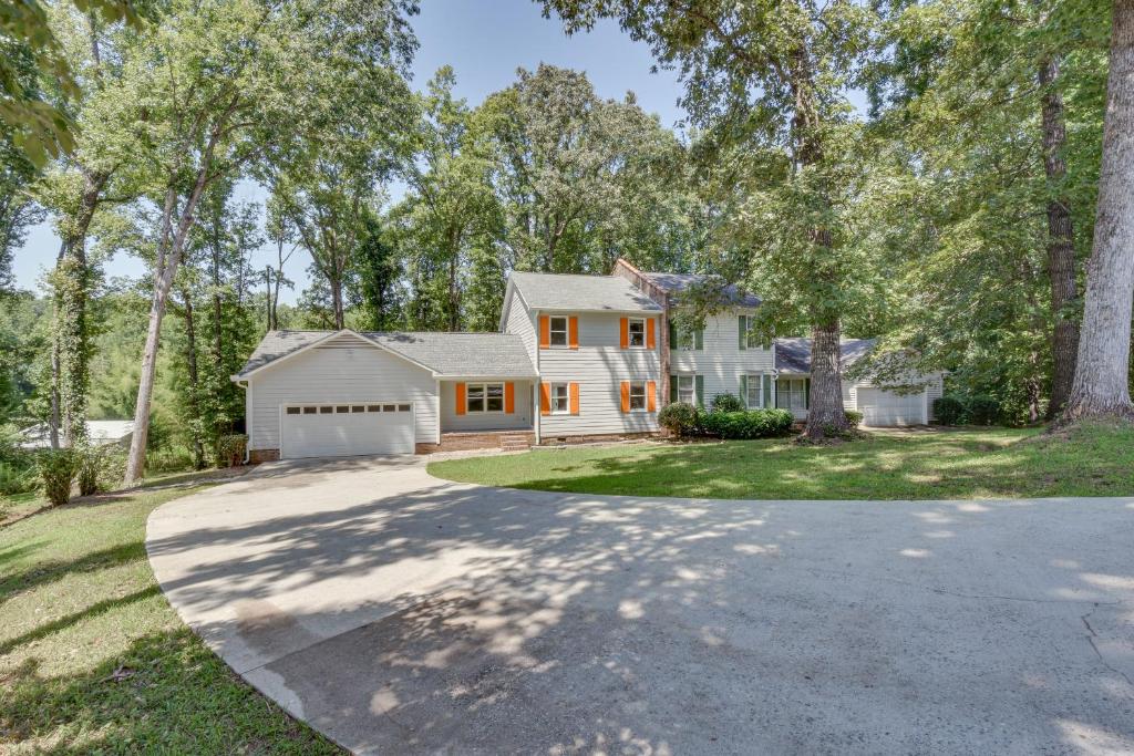 a house with a driveway and a garage at Charming Seneca Home - 3 Mi to Memorial Stadium! in Seneca