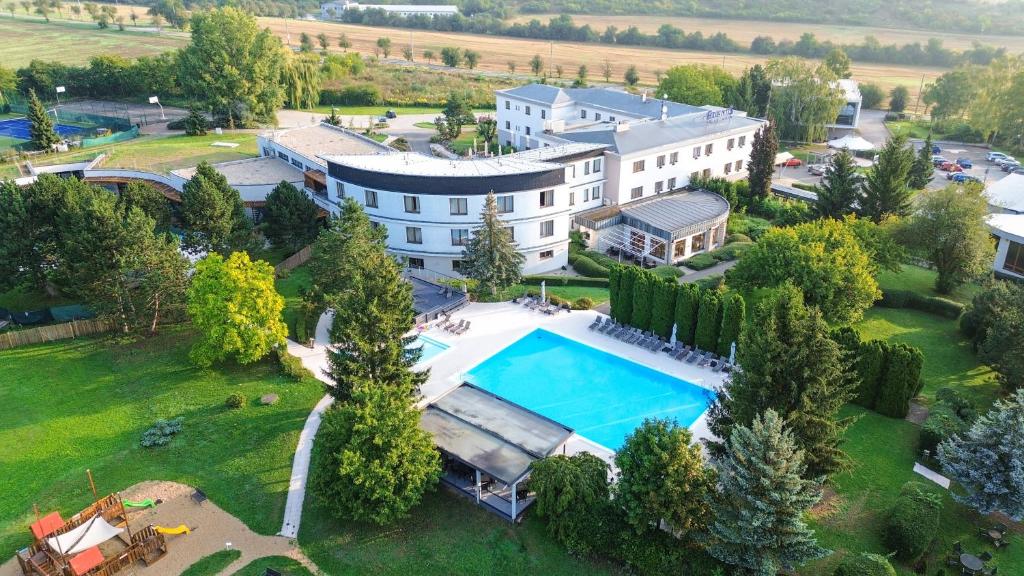 an aerial view of a mansion with a swimming pool at Hotel Atlantis in Brno