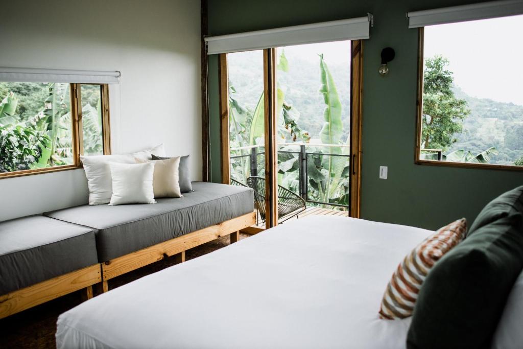 Postel nebo postele na pokoji v ubytování Hotel La Palma y El Tucán - Café y Naturaleza