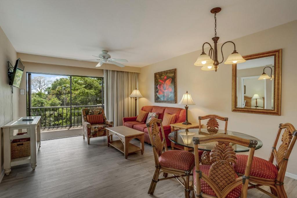 a living room with a couch and a table at Fabulous Park Shore Condo in Naples