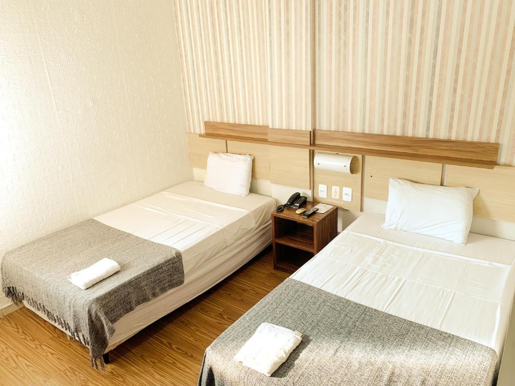 Postel nebo postele na pokoji v ubytování Hotel do Largo Manaus