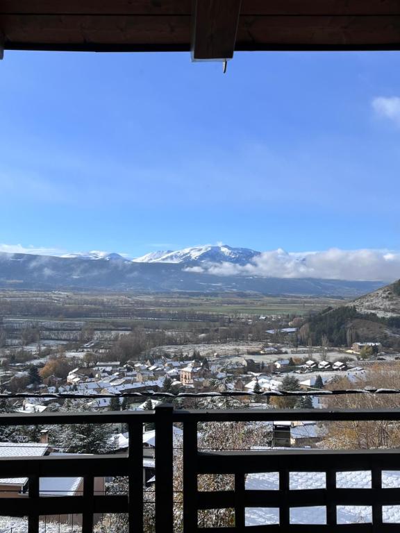 a view of the snow covered mountains from a balcony at Nuevo Cosy Loft 4pax Estavar in Estavar