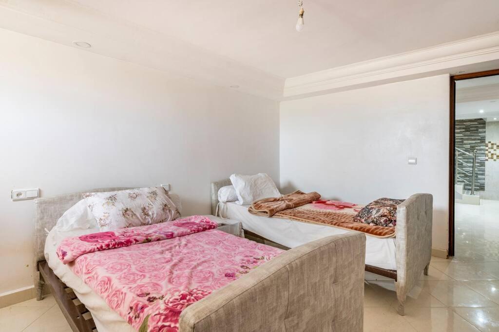 Postel nebo postele na pokoji v ubytování Villa avec vue sur mer