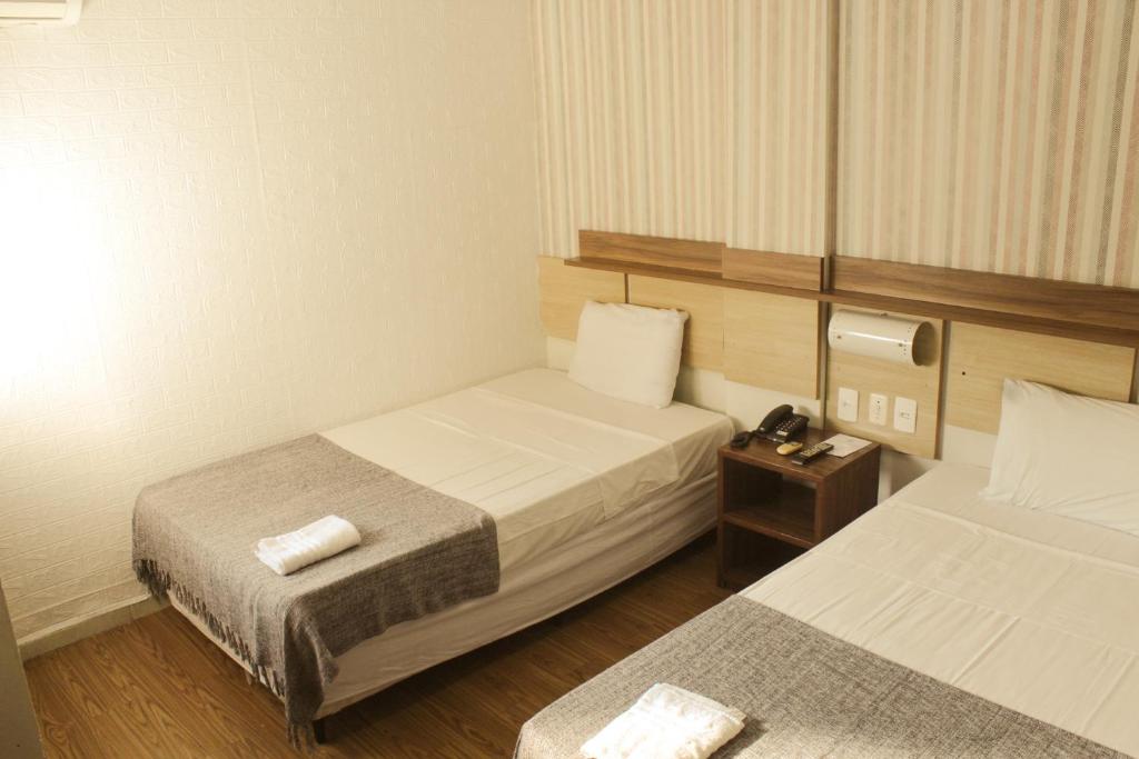 Postel nebo postele na pokoji v ubytování Hotel do Largo Manaus