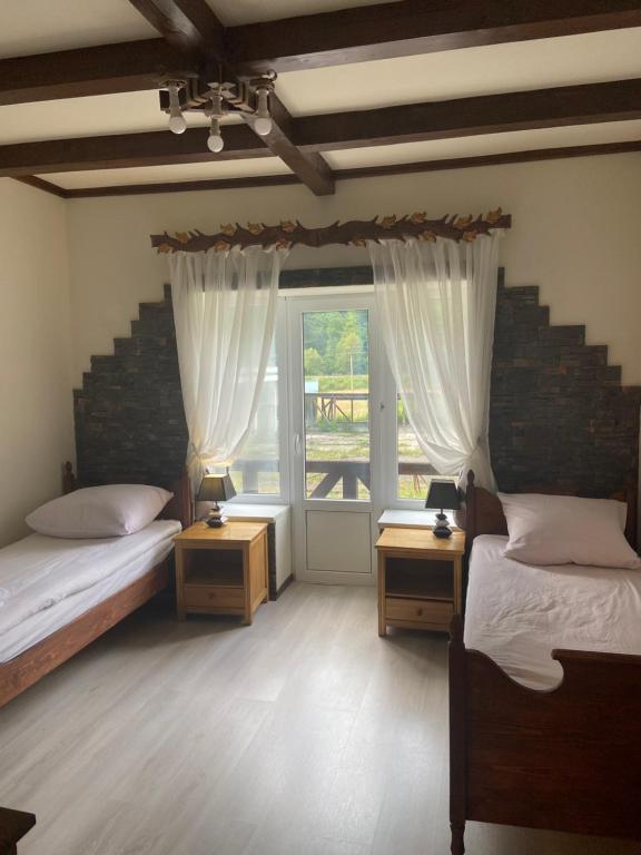 Postel nebo postele na pokoji v ubytování Hotel Tys