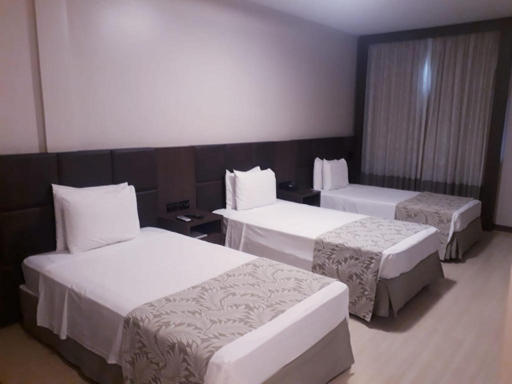 Postel nebo postele na pokoji v ubytování Copas Verdes Hotel
