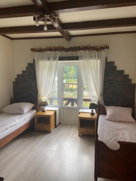 Postel nebo postele na pokoji v ubytování Hotel Tys