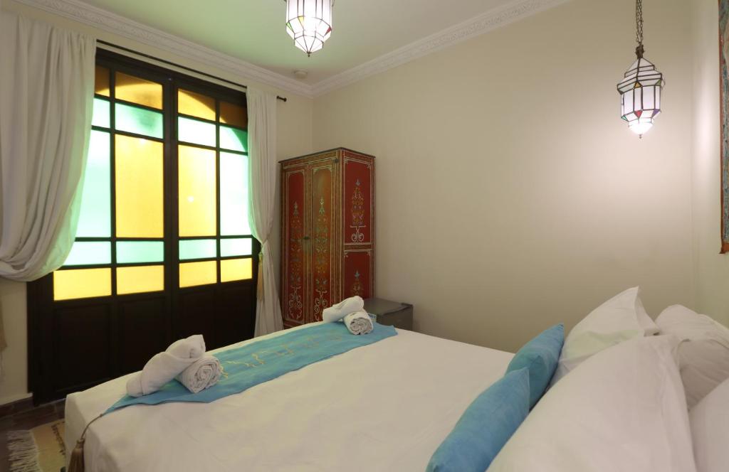 Postel nebo postele na pokoji v ubytování Riad 22 - L'Etoile d'Orient